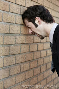 businessman-banging-his-head-against-the-wall-ispc026073.jpg